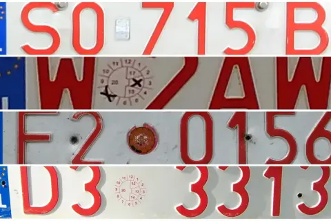 Czerwone tablice rejestracyjne z białymi literami: SO 715 B, WZAW, F2 0156, D3 3313.